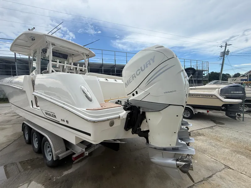 Slide: The Image of 2017 Boston Whaler 350 Outrage boat with Mercury outboard engine on trailer. - 12