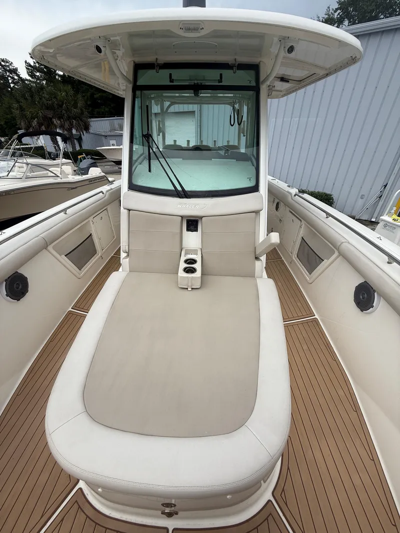 Slide: The Image of 2017 Boston Whaler 350 Outrage boat with spacious deck and comfortable seating. - 19