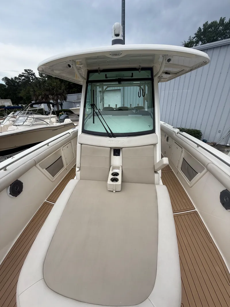 Slide: The Image of 2017 Boston Whaler 350 Outrage boat with spacious deck and modern design. - 20