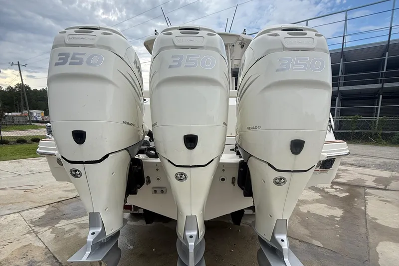 Slide: The Image of 2017 Boston Whaler 350 Outrage with triple 350 Verado engines, rear view. - 27