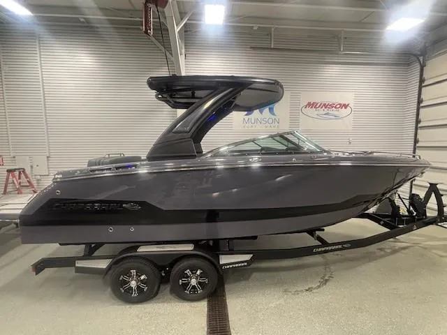 Slide: The Image of 2025 Chaparral 2870 boat in showroom, sleek design, on trailer. - 0