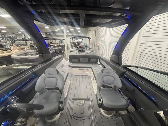 Slide: The Image of Interior view of 2025 Chaparral 2870 boat, showcasing sleek design and modern seating. - 12