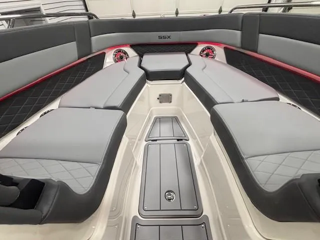 Slide: The Image of 2025 Chaparral 2870 boat interior with gray seating and red accents. - 17