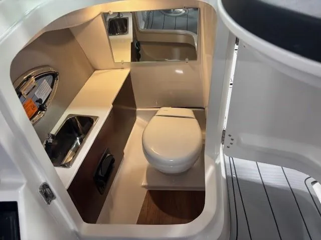 Slide: The Image of 2025 Chaparral 2870 boat interior bathroom with sink and toilet. - 20
