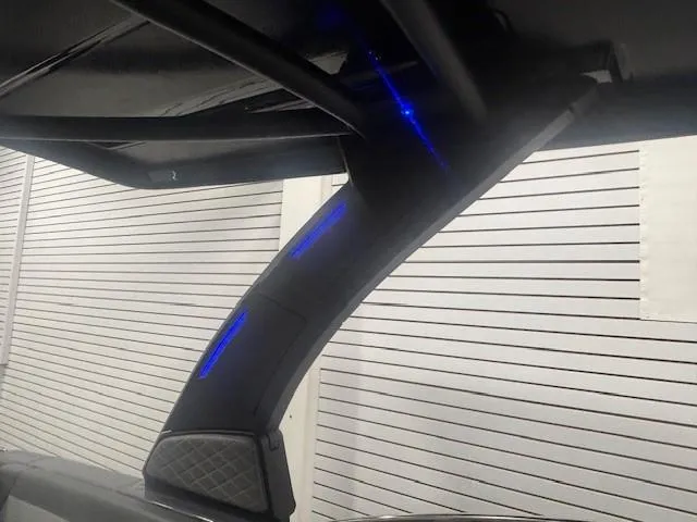 Slide: The Image of 2025 Chaparral 2870 boat interior with sleek design and blue LED lighting. - 21