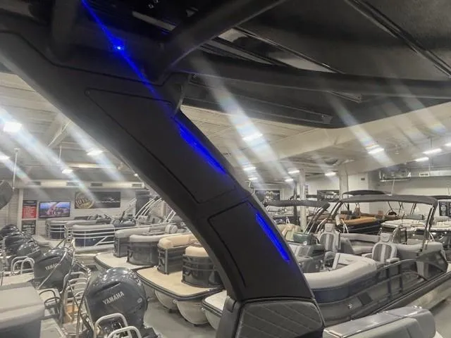 Slide: The Image of Showroom with 2025 Chaparral 2870 boats, featuring sleek design and modern lighting. - 26