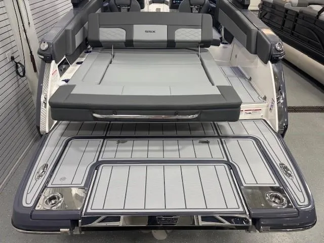 Slide: The Image of 2025 Chaparral 2870 boat with spacious rear deck and seating area. - 28