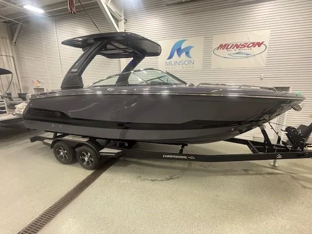 Slide: The Image of 2025 Chaparral 2870 boat on trailer in showroom, side view. - 3