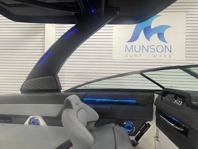 Slide: The Image of Interior of 2025 Chaparral 2870 boat with modern design and blue LED accents. - 33