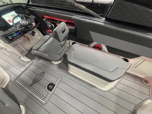Slide: The Image of Interior of 2025 Chaparral 2870 boat, featuring modern helm and seating. - 36