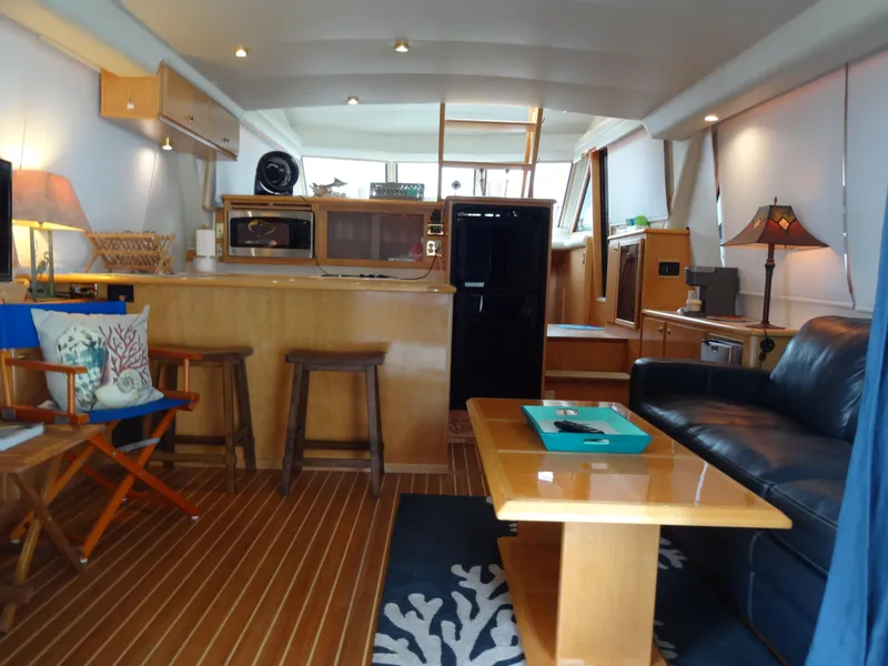 Slide: The Image of Interior of a 1998 Navigator 53 Classic yacht with cozy seating and modern amenities. - 12
