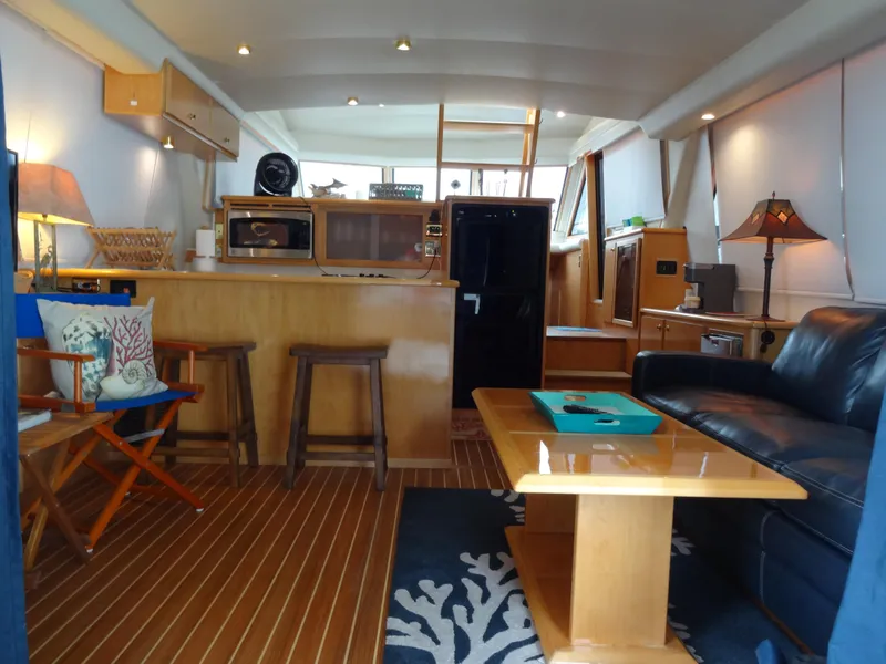 Slide: The Image of Interior of 1998 Navigator 53 Classic yacht with cozy seating and modern amenities. - 13