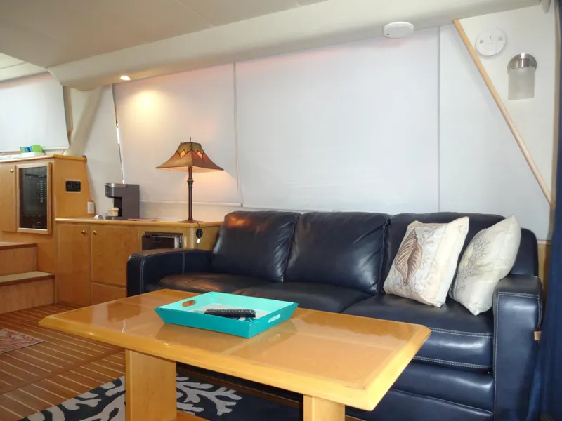 Slide: The Image of Luxurious 1998 Navigator 53 Classic yacht interior with leather sofa and elegant decor. - 15