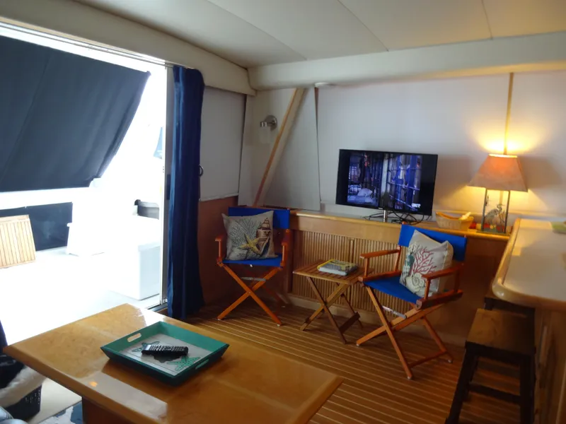 Slide: The Image of Interior of 1998 Navigator 53 Classic yacht with cozy seating and TV. - 16