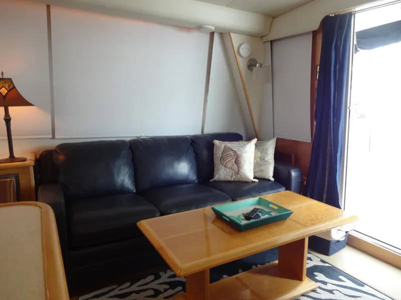 Slide: The Image of Luxurious 1998 Navigator 53 Classic yacht interior with leather sofa and wooden table. - 17