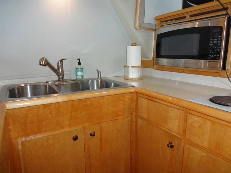 Slide: The Image of Kitchen area of 1998 Navigator 53 Classic yacht with sink and microwave. - 23