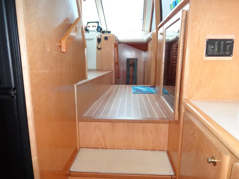 Slide: The Image of Interior stairs of 1998 Navigator 53 Classic yacht with wooden finish. - 25