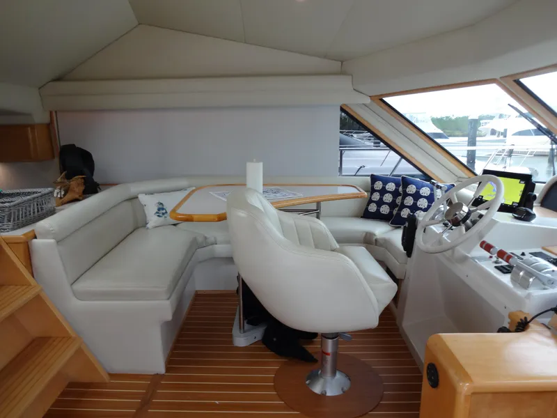 Slide: The Image of Interior of 1998 Navigator 53 Classic yacht with helm, seating, and wooden flooring. - 26