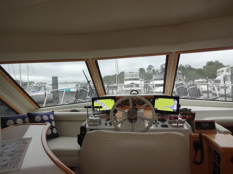 Slide: The Image of Interior view of 1998 Navigator 53 Classic yacht helm with navigation screens. - 28