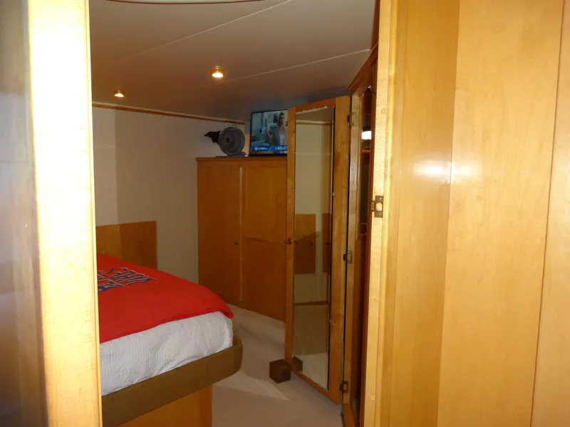Slide: The Image of Cozy bedroom interior on 1998 Navigator 53 Classic yacht with wooden furnishings. - 34