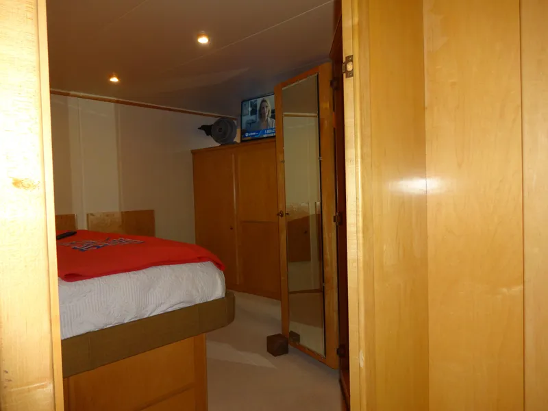 Slide: The Image of Interior of 1998 Navigator 53 Classic yacht bedroom with wooden furnishings and TV. - 35