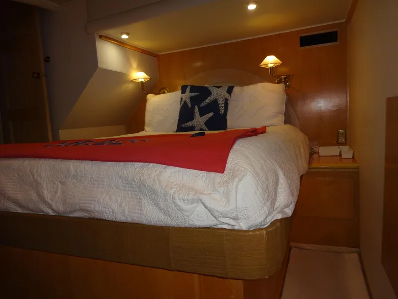Slide: The Image of Cozy bedroom in 1998 Navigator 53 Classic yacht with starfish pillow and warm lighting. - 41
