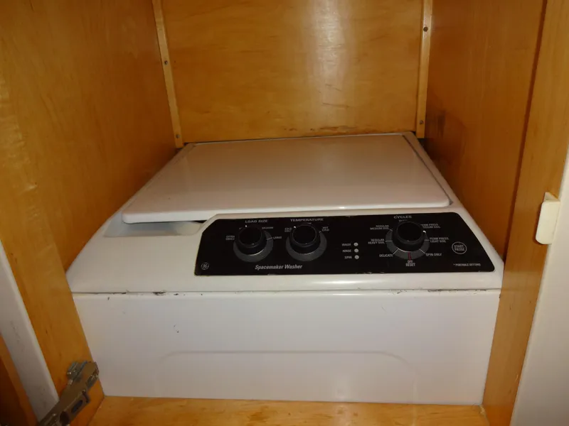 Slide: The Image of Compact GE Spacemaker washer in wooden cabinet, Navigator 53 Classic, 1998 model. - 43
