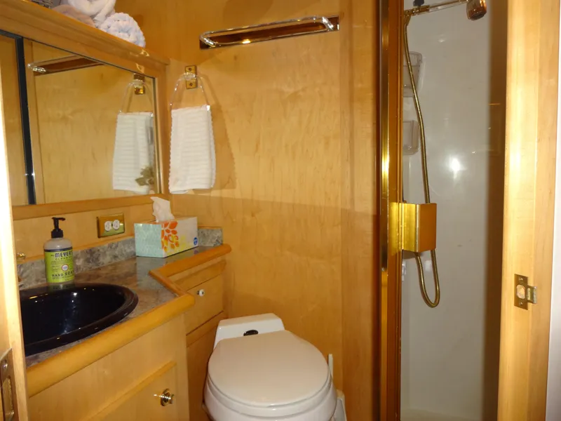 Slide: The Image of Luxurious bathroom in 1998 Navigator 53 Classic yacht with shower, sink, and toilet. - 47