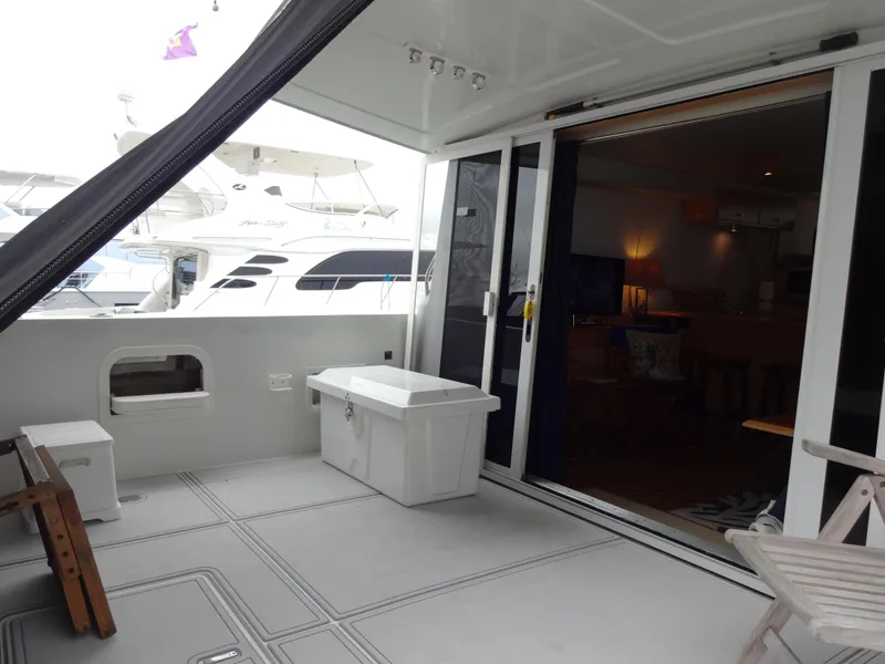 Slide: The Image of 1998 Navigator 53 Classic yacht interior with open deck and sliding glass doors. - 8