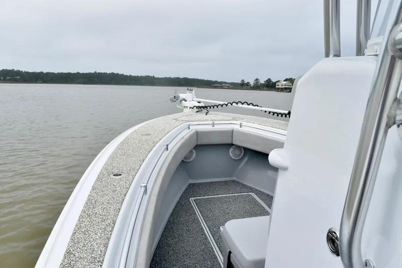 Slide: The Image of 2018 Contender 25T boat on calm water, showcasing sleek design and spacious deck. - 9