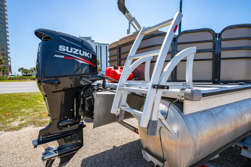 Slide: The Image of 2016 Misty Harbor 2285CS Biscayne Bay pontoon boat with Suzuki outboard motor. - 3