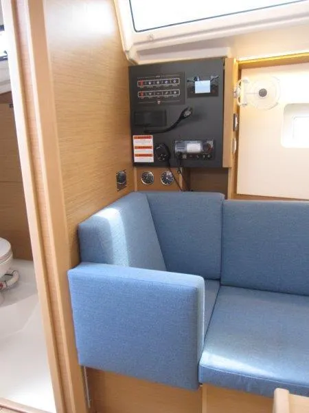 Slide: The Image of Interior of 2025 Jeanneau Sun Odyssey 350 yacht with blue seating and control panel. - 4