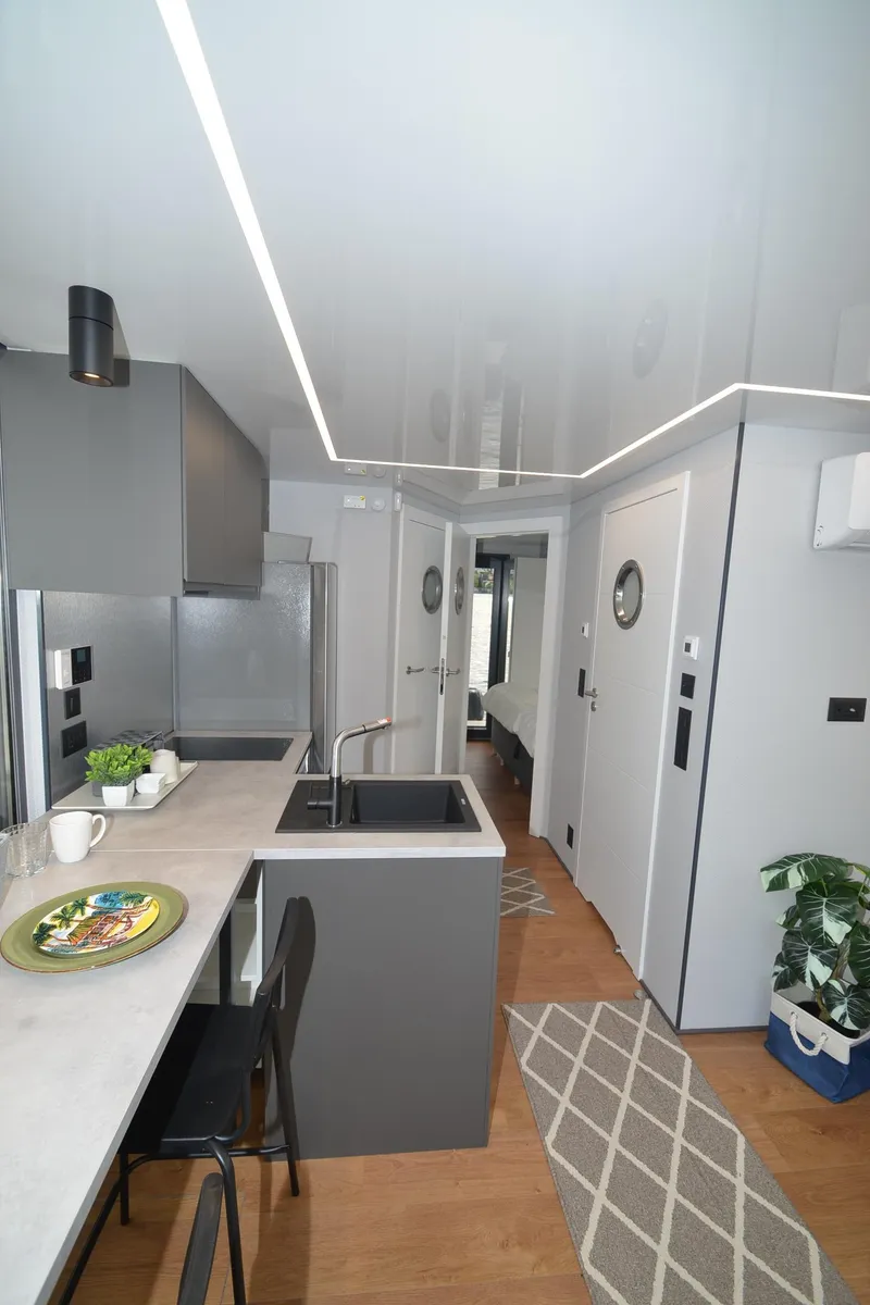 Slide: The Image of Modern kitchen interior in La Mare Modern 11, 2024 model, featuring sleek design and contemporary decor. - 19