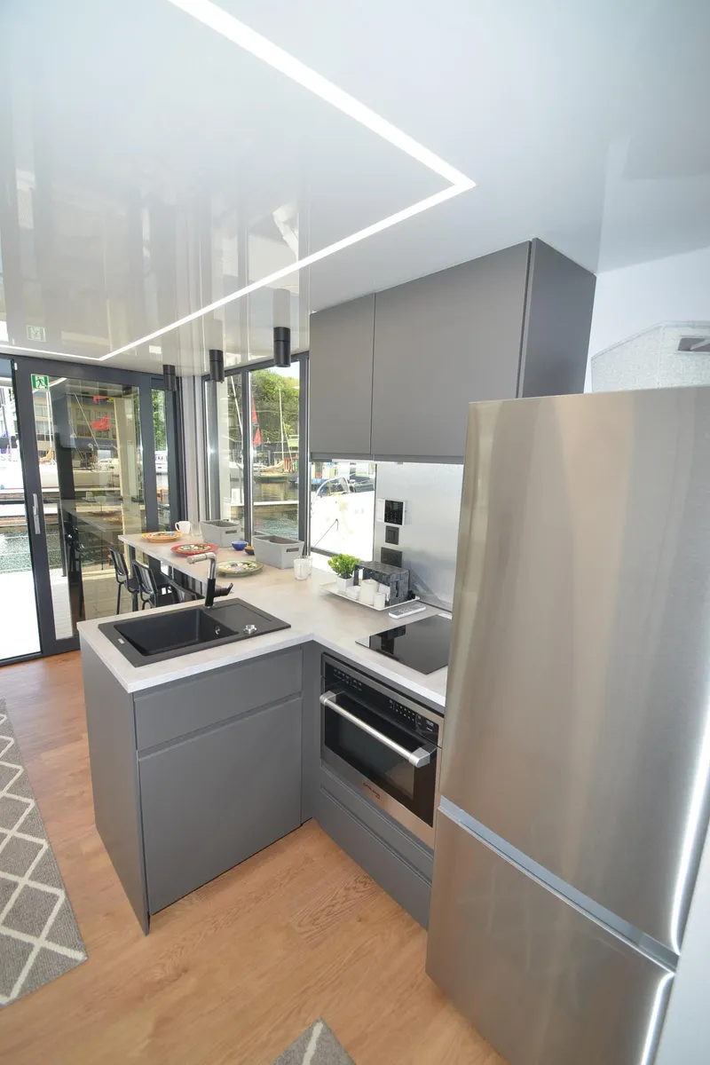 Slide: The Image of Modern kitchen with sleek appliances, featuring La Mare Modern 11, 2024 model. - 11