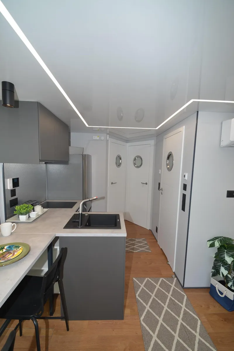 Slide: The Image of Modern kitchen interior in 2024 La Mare Modern 11 houseboat, featuring sleek design and compact layout. - 21
