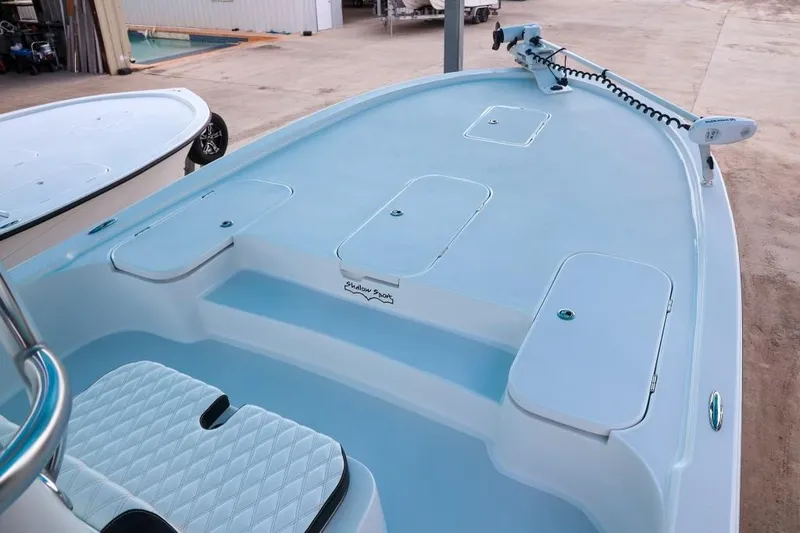 Slide: The Image of 2023 Shallow Sport 28 X3 boat deck with storage compartments and seating. - 15