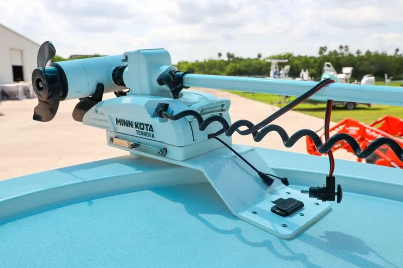 Slide: The Image of Minn Kota Terrova motor on 2023 Shallow Sport 28 X3 boat, outdoor setting. - 18