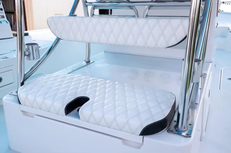 Slide: The Image of 2023 Shallow Sport 28 X3 boat seating with white quilted upholstery and stainless steel frame. - 20