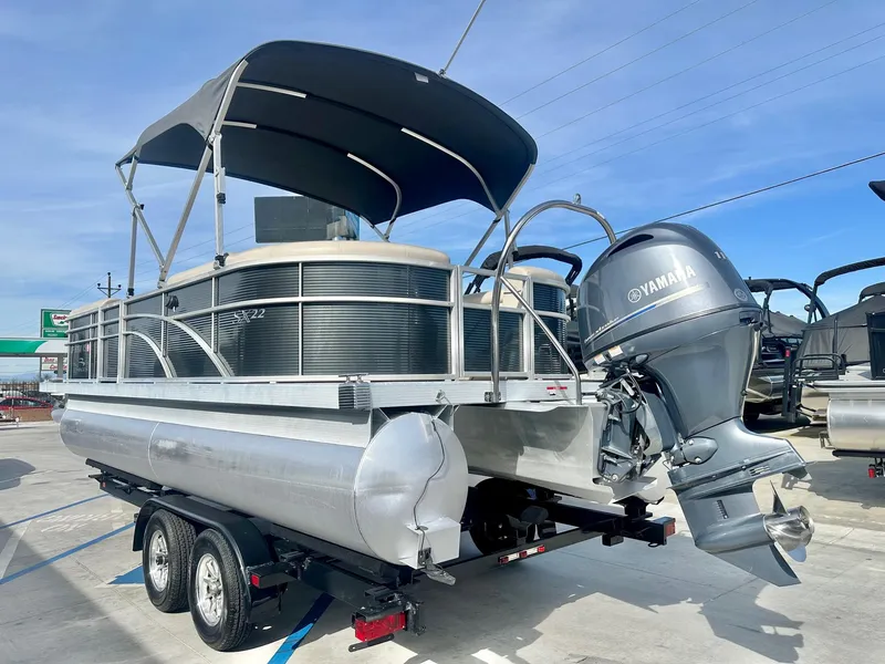 Slide: The Image of 2019 Bennington 22 SSX pontoon boat with Yamaha 115HP engine on trailer. - 12