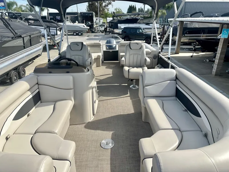 Slide: The Image of 2019 Bennington 22 SSX pontoon boat interior with Yamaha 115HP, featuring spacious seating. - 13