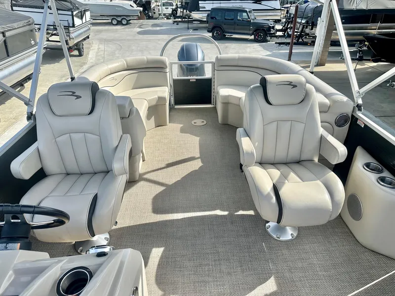 Slide: The Image of 2019 Bennington 22 SSX boat interior with Yamaha 115HP, featuring plush seating and spacious layout. - 14