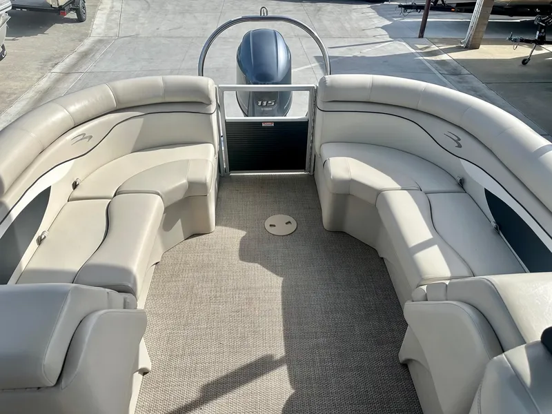 Slide: The Image of 2019 Bennington 22 SSX boat interior with Yamaha 115HP engine, featuring spacious seating. - 15