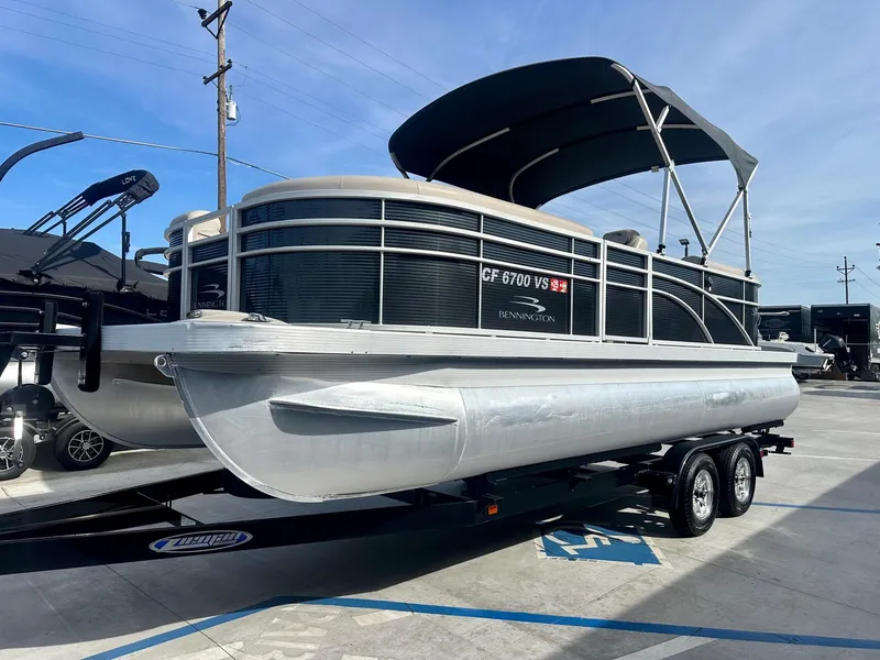 Slide: The Image of 2019 Bennington 22 SSX pontoon boat with Yamaha 115HP engine on trailer. - 3
