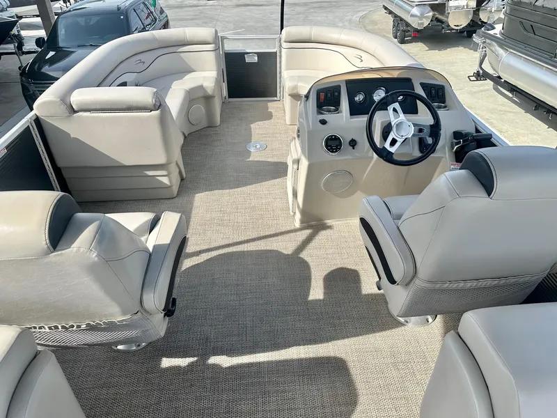 Slide: The Image of 2019 Bennington 22 SSX boat interior with Yamaha 115HP, featuring spacious seating and modern controls. - 5