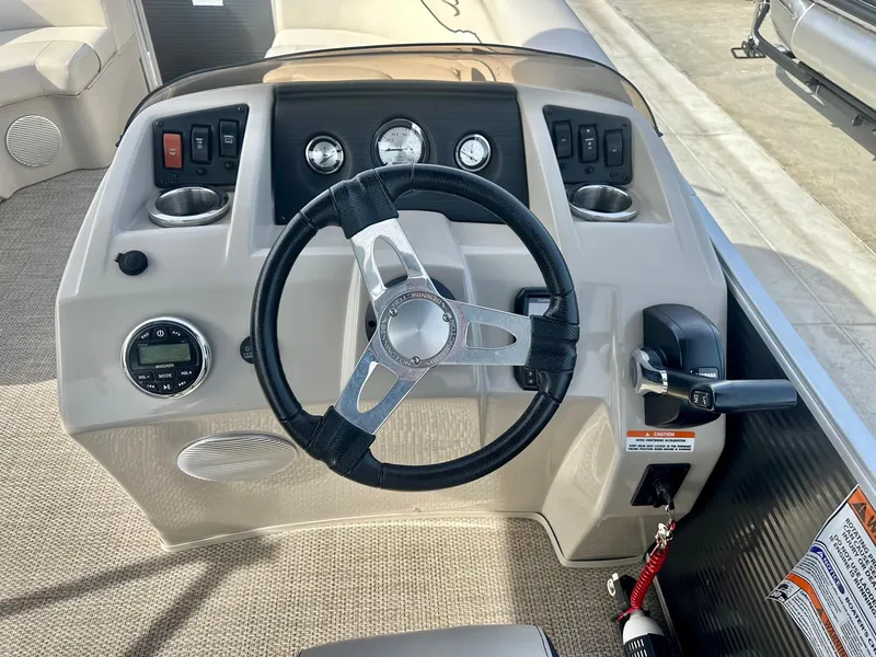 Slide: The Image of 2019 Bennington 22 SSX boat dashboard with steering wheel and Yamaha controls. - 7