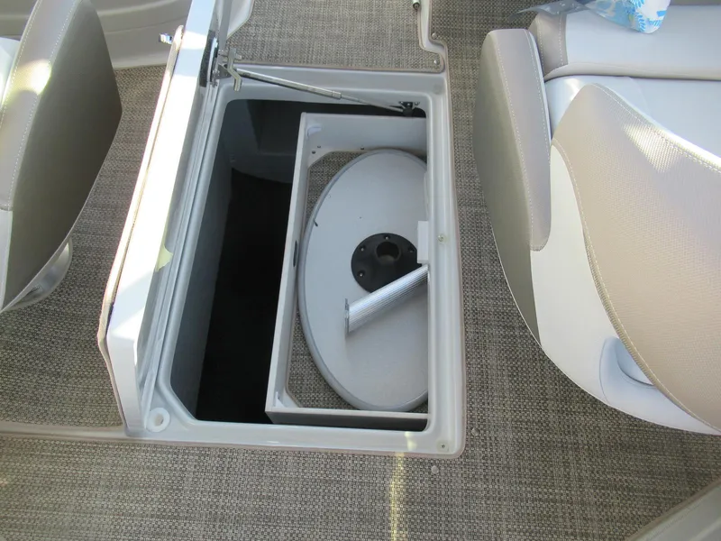 Slide: The Image of 2019 Crownline 285SS boat interior storage compartment with open hatch and seating. - 12