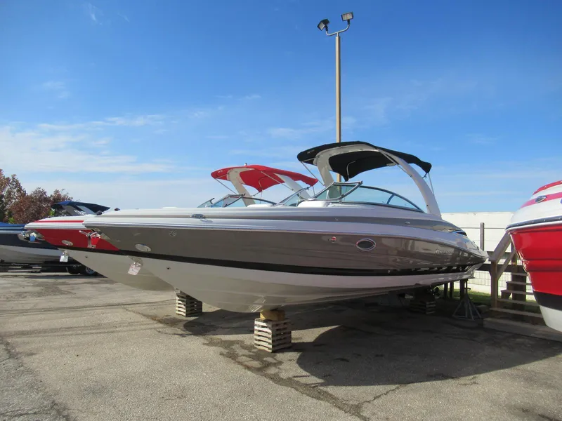 Slide: The Image of 2019 Crownline 285SS boat displayed outdoors on a sunny day. - 15