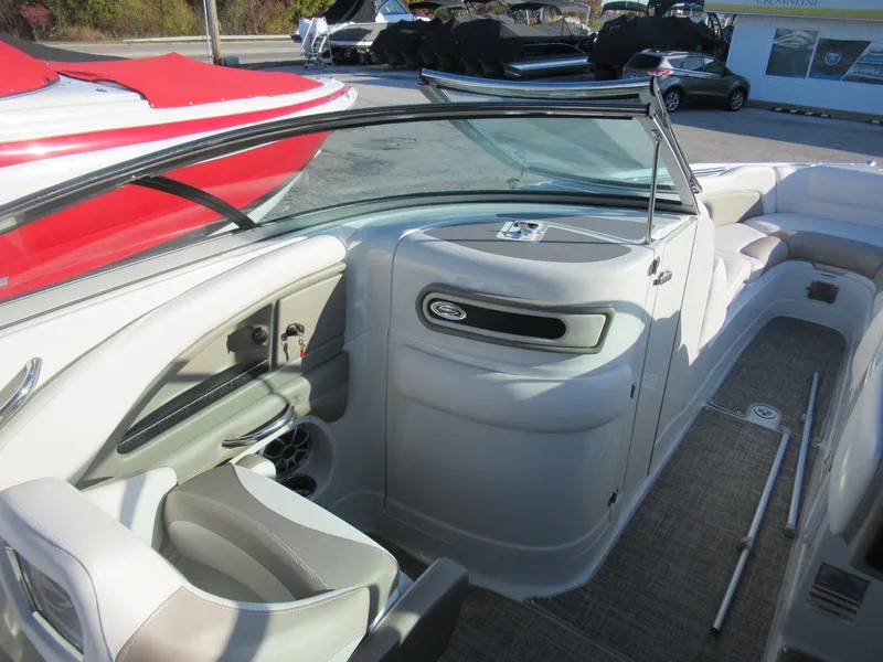 Slide: The Image of 2019 Crownline 285SS boat interior with seating and dashboard, showcasing modern design and comfort. - 18