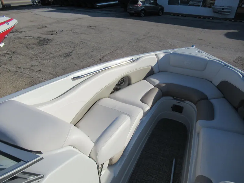 Slide: The Image of 2019 Crownline 285SS boat interior with plush seating and sleek design. - 20
