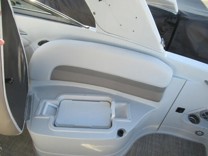 Slide: The Image of 2019 Crownline 285SS boat interior with storage compartment and seating. - 22